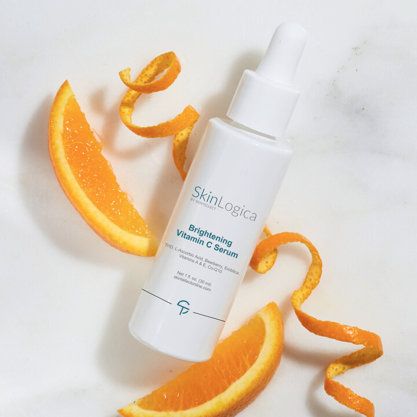 SkinLogica Brightening Vitamin C Serum with orange slices on a white background